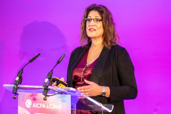 woman speaking at podium