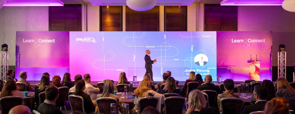 man speaking on stage